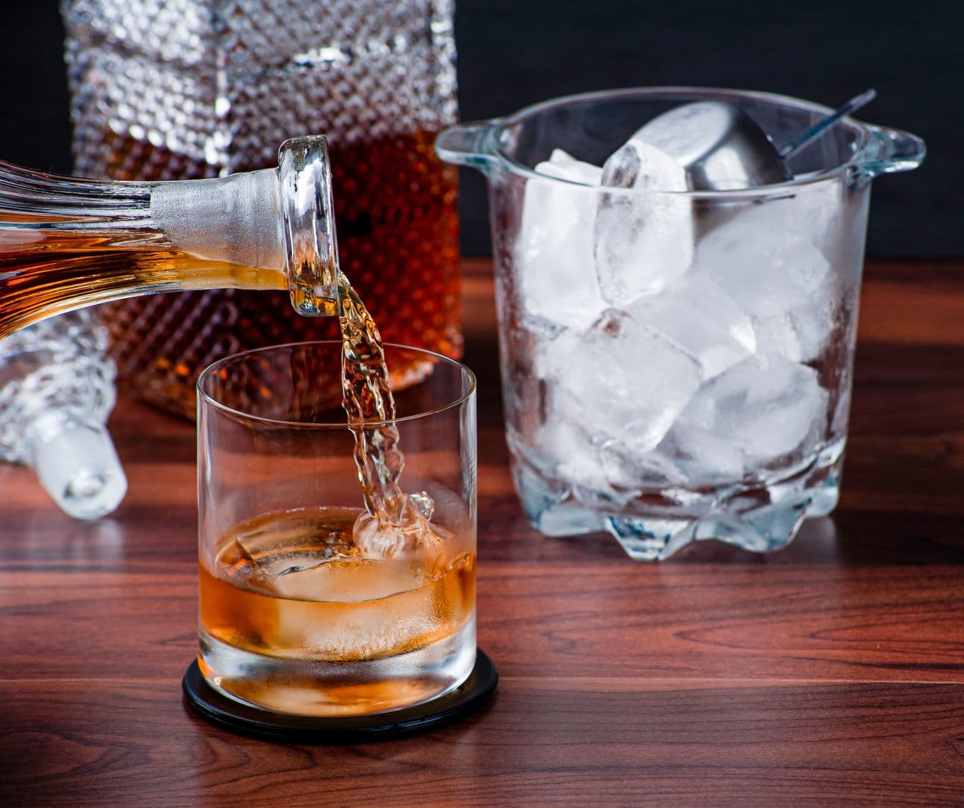 Big Dog Bourbon being poured over ice for the Zip & Sip tasting at The Nashville Distillery, behind the Fontanel Mansion